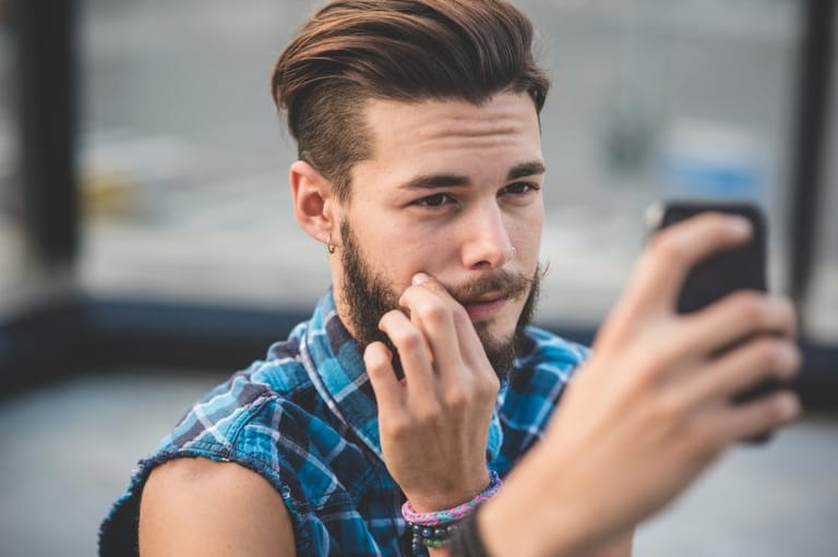 bearded hipster man phone