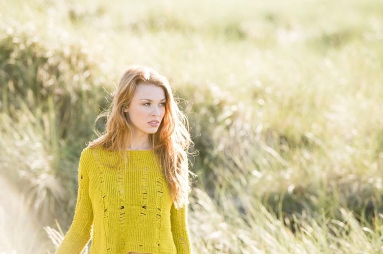 woman field serious grass