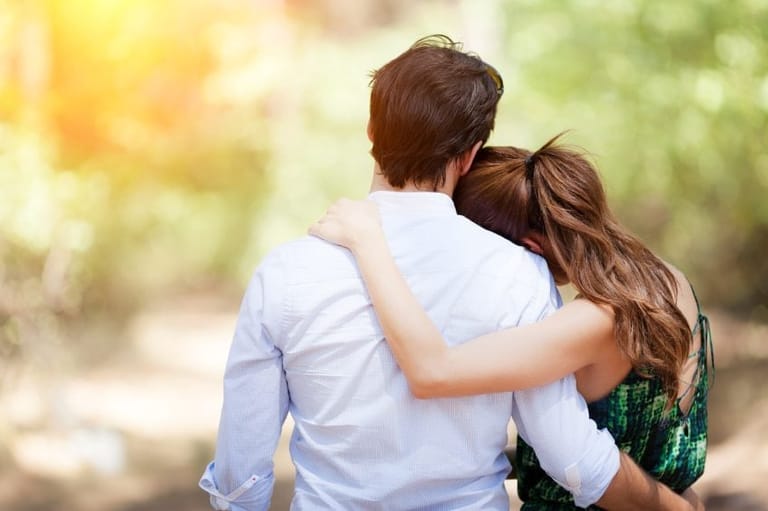 couple embracing back