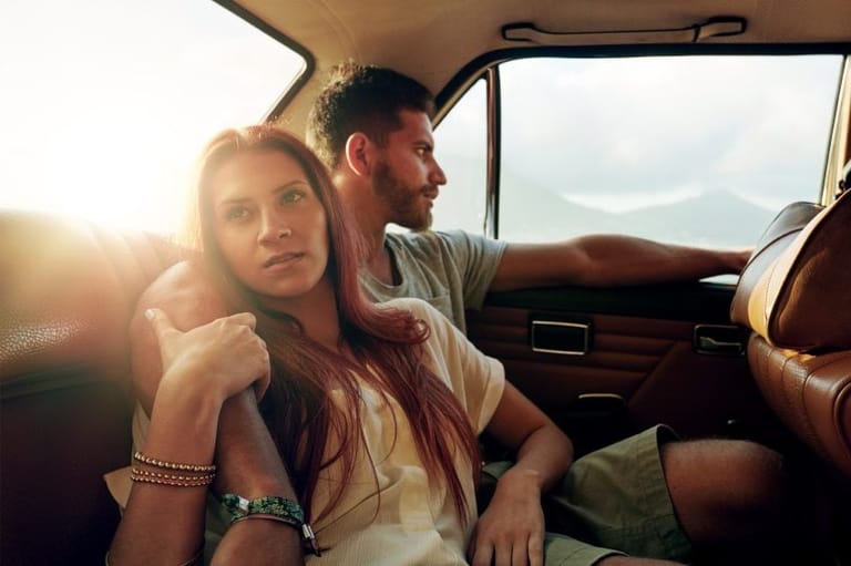 Young adult couple in car
