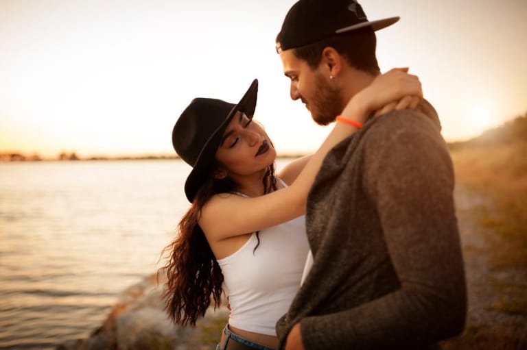 Couple on beach hugging