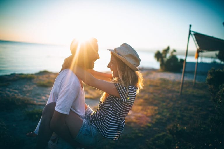 couple sunset beach