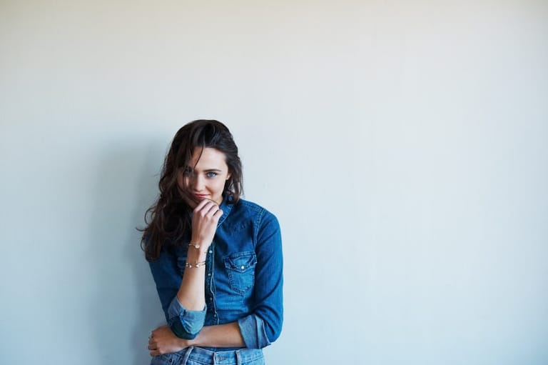 woman smirking portrait denim white