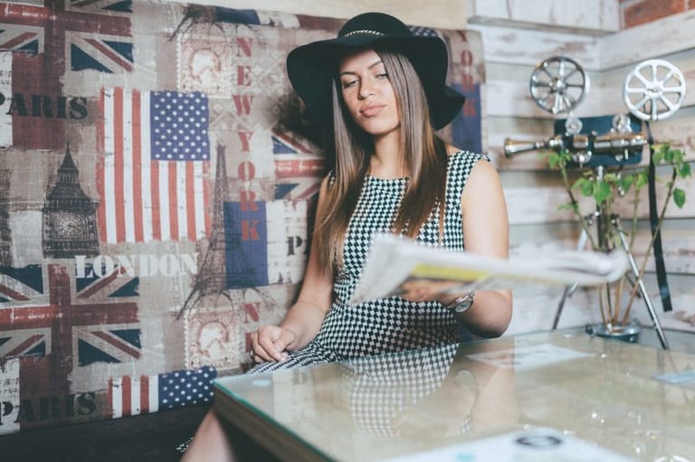 Woman with newspaper