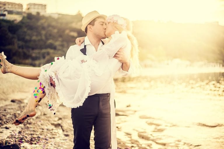 man woman wedding beach