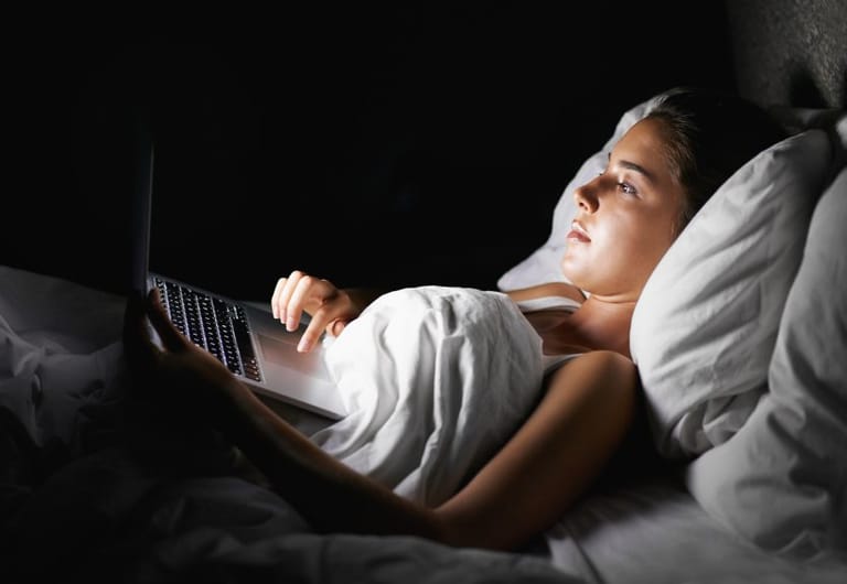 Young girl watching laptop