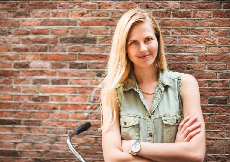 confident woman arms crossed outdoors