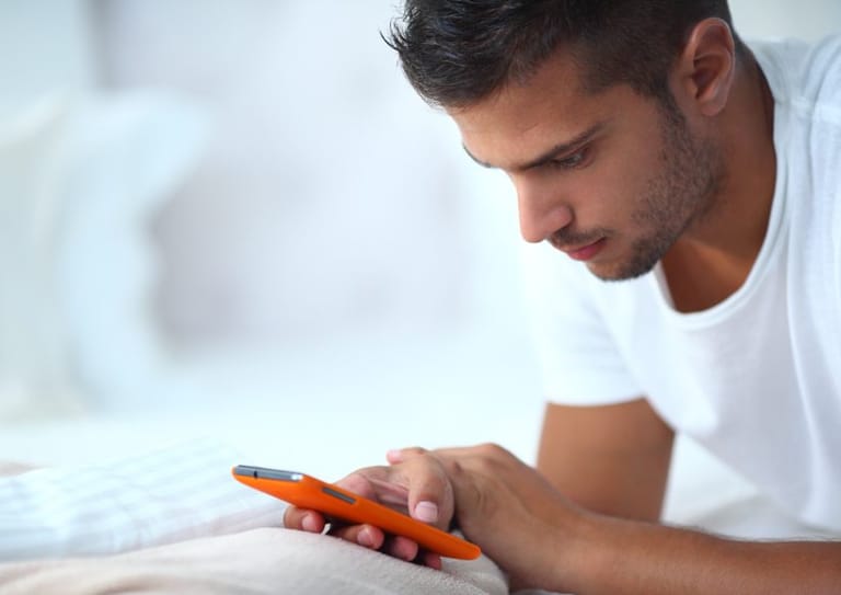 Guy texting on phone
