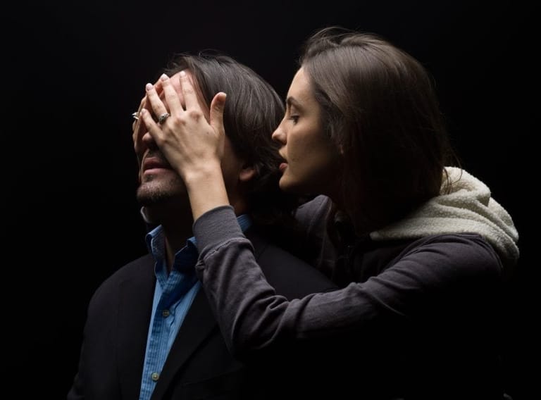Couple whispering in ear