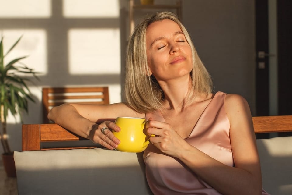 Woman enjoying her morning coffee.