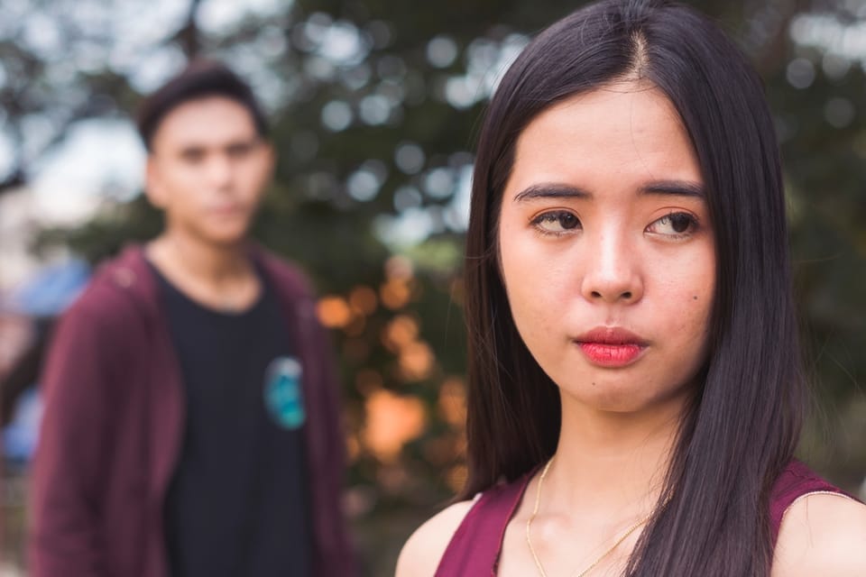 Young woman confused by her boyfriend.