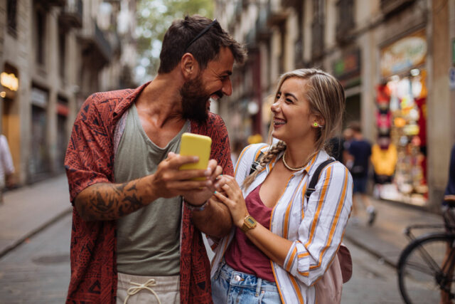 happy couple walking city streets