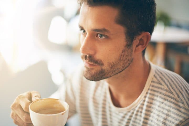 serious man drinking morning coffee
