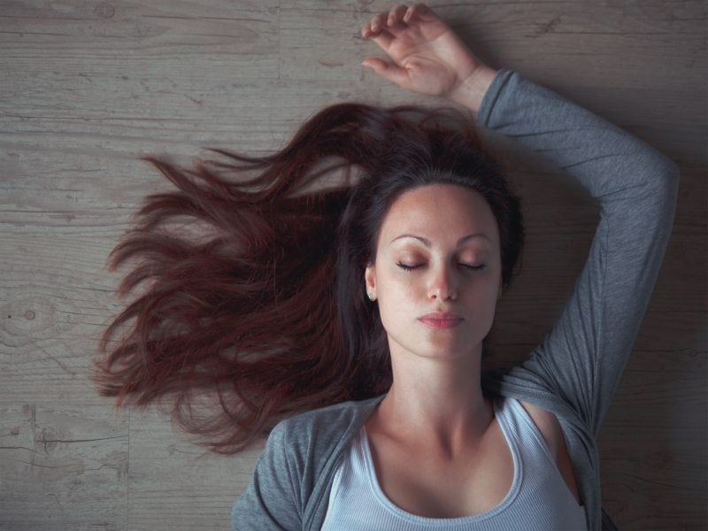 woman sleeping on floor