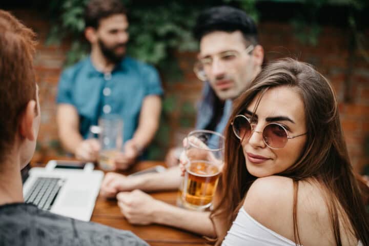 woman sitting drinking beer