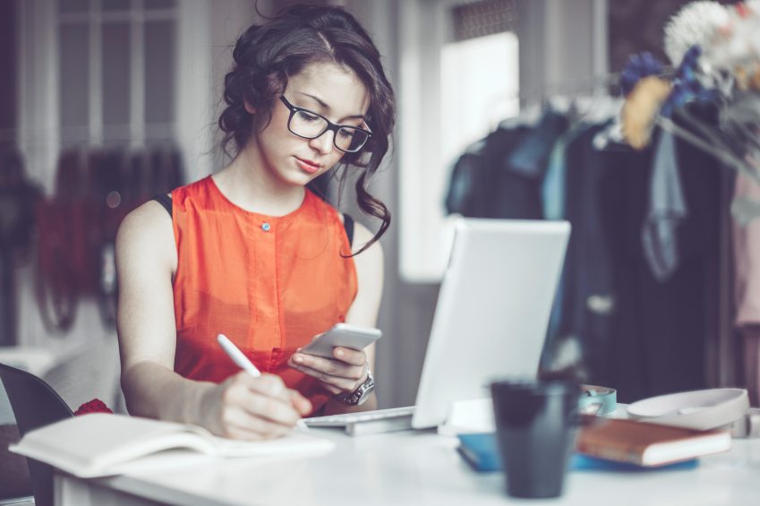 Woman busy working at laptop.