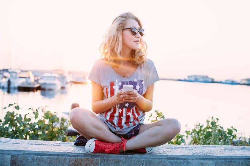Blonde hipster on wall