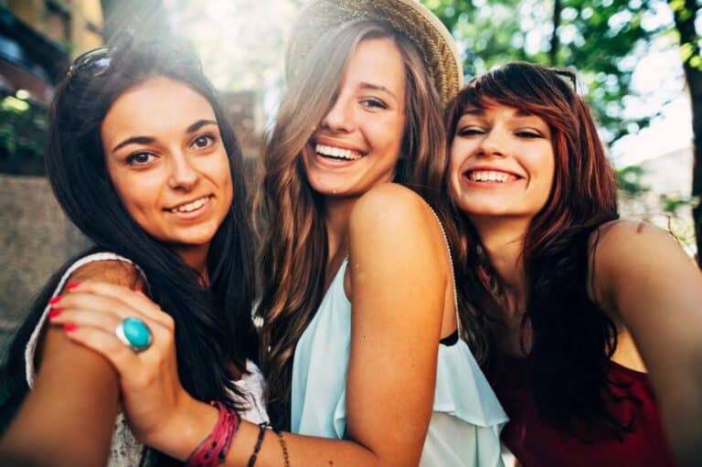 Three girlfriends laughing