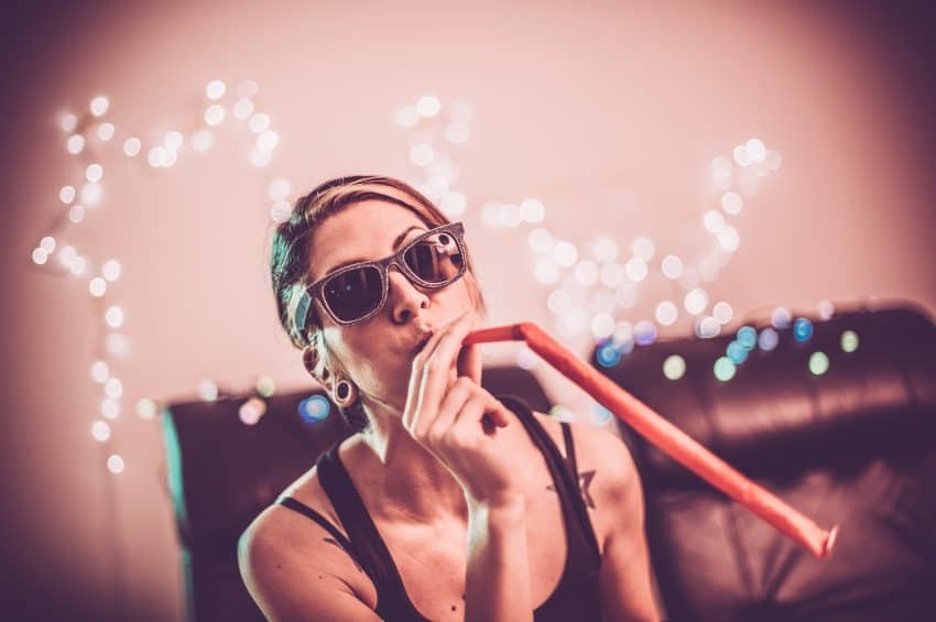 Girl blowing a whistle and bubbles
