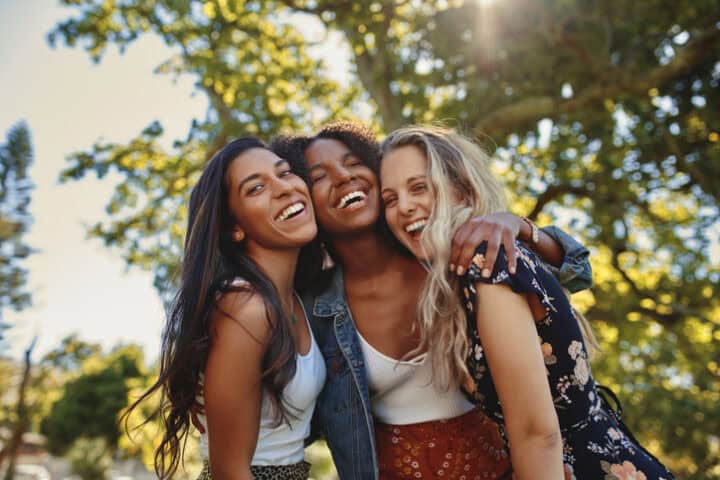 happy best friends smiling outdoors