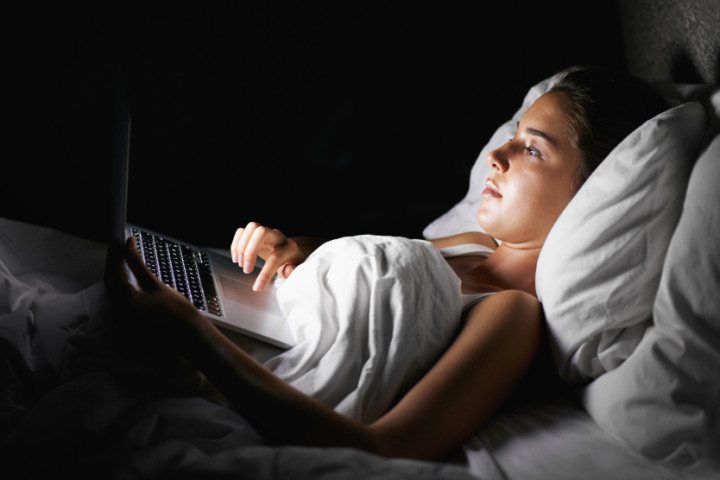 Young girl watching laptop