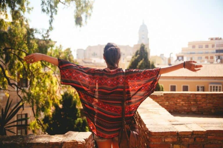 Brunette arms outstretched scarf
