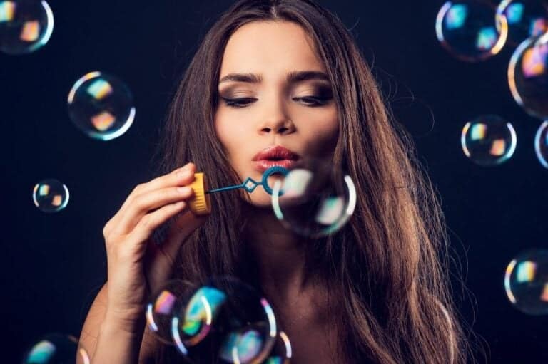 Brunette blowing bubbles