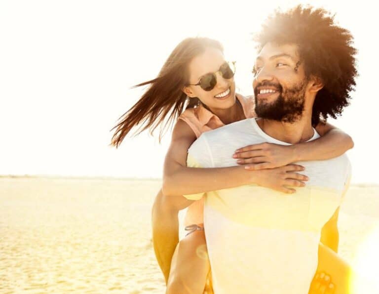 Bi racial couple on beach