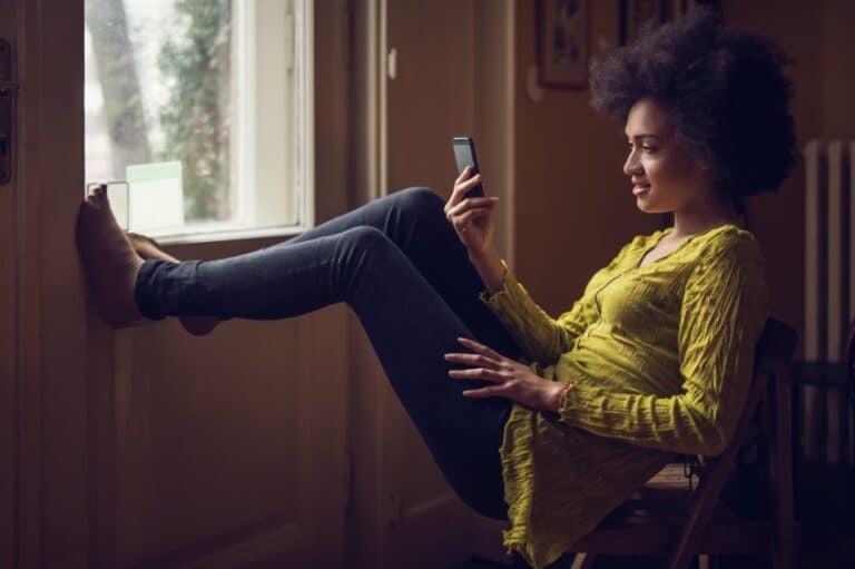 Young African American woman reading a text