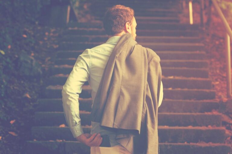 Guy walking up steps