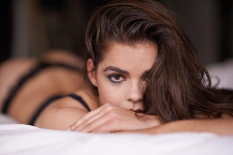 Woman in bed facing camera