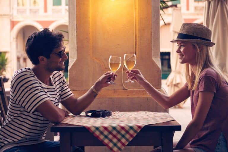Couple with wine at table