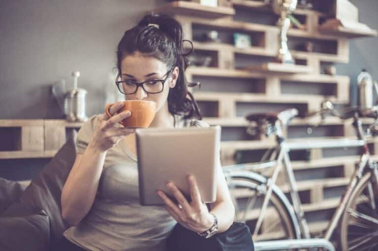 Brunette drinking coffee at home