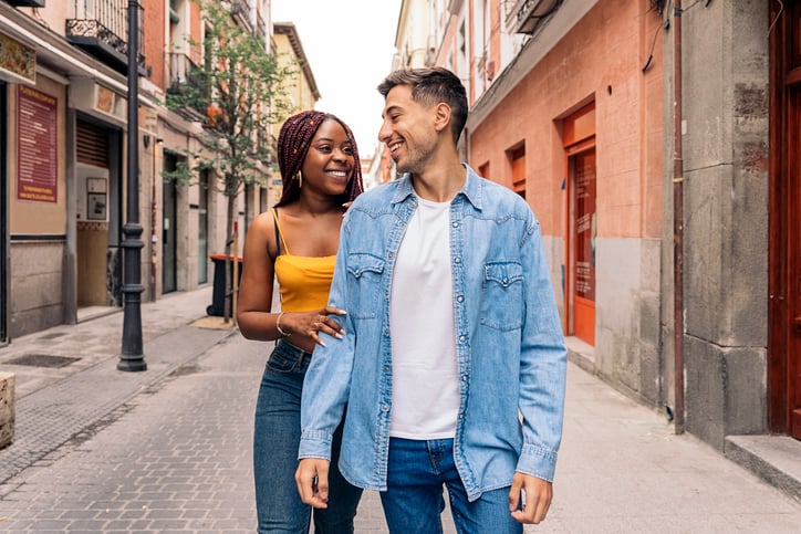 trendy couple walking city streets