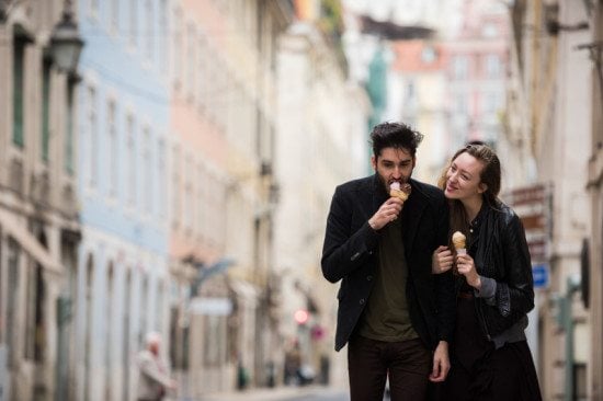 couple eating ice cream on city street