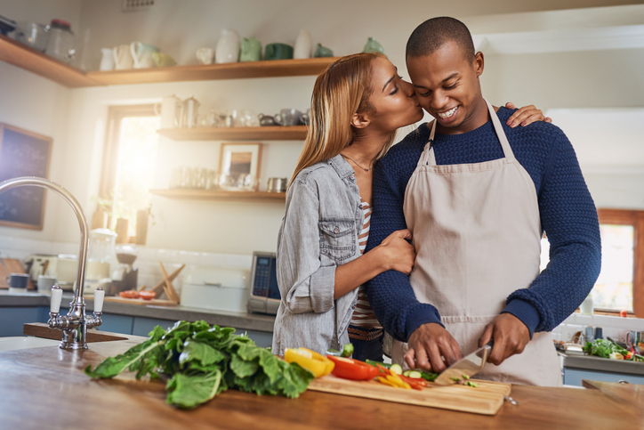 Couple cooking together.