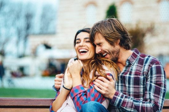 laughing couple in park