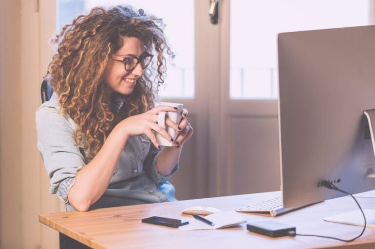 Happy woman working on her computer.