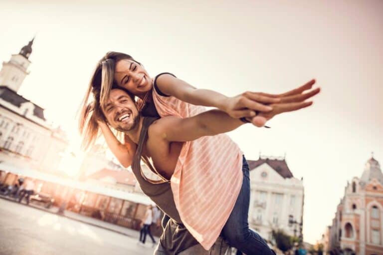 happy couple laughing city