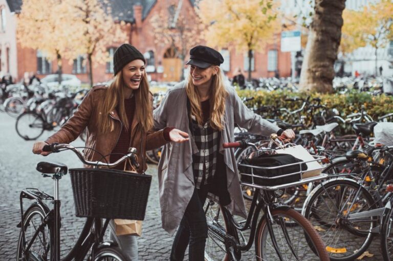 girls laughing bikes spring