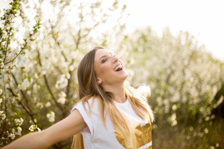 woman happy trees outside