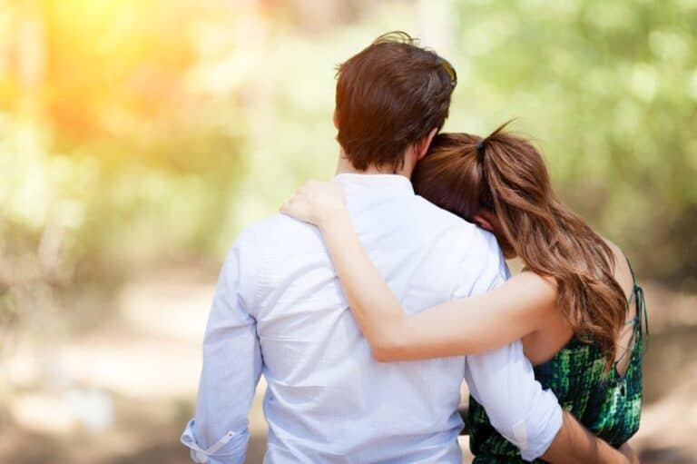 couple embracing back