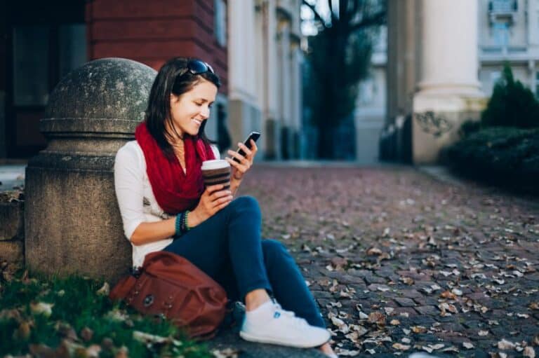 woman phone coffee outside