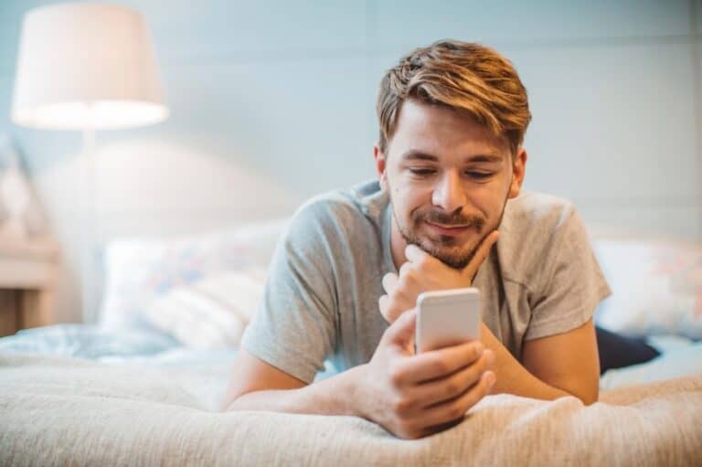 man with beard using mobile