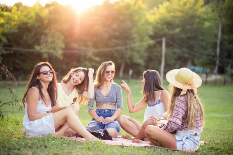 women friends park grass