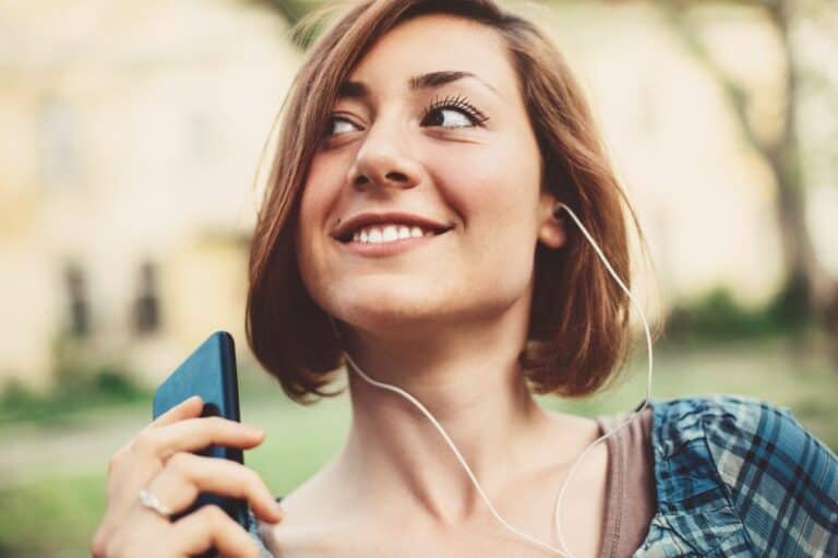 woman happy music headphones