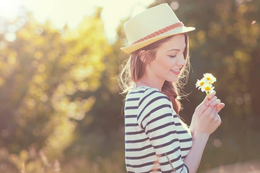 woman flower sunshine field