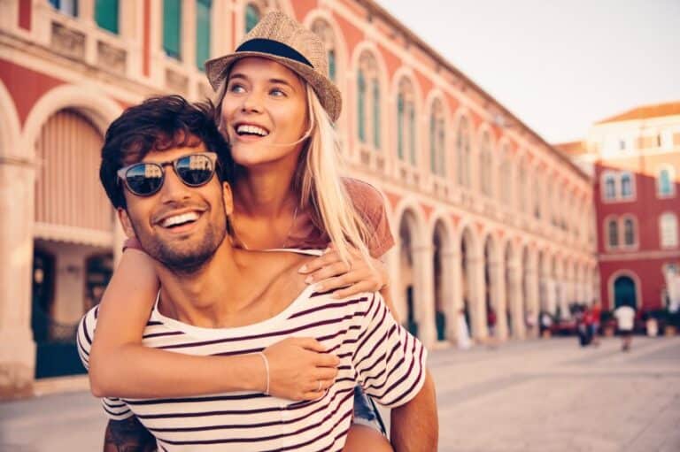 embracing couple on city break