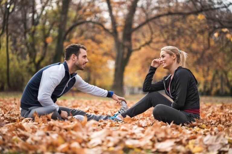 happy couple park fall running