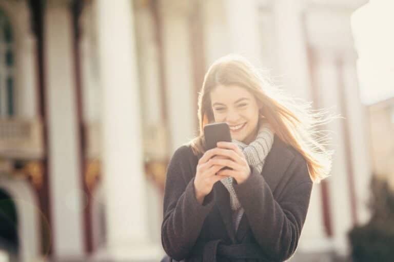 woman phone sunshine